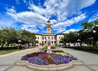 Exploring History and Diversity in Colorado Springs Flowers in front of the Colorado Springs Pioneers Museum