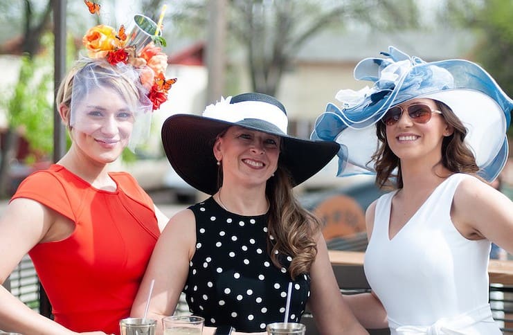 Three women in fancy hats for Axe and the Oak's annual Kentucky Derby Party, one of the best things to do this weekend in Colorado Springs