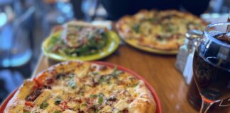 A wood-oven pizza and glass of wine at Il Vicino restaurant in Colorado Springs.