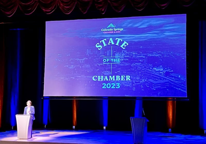 Johnna Reeder Kleymeyer speaks onstage at the State of the Chamber in Colorado Springs.