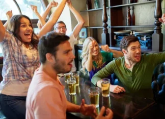 Colorado Sports Fanatic Bar & Grill Fans cheering on their favorite sports teams at a bar like Colorado Sports Fanatic Bar & Grill