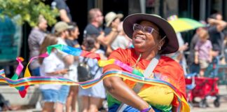 5 Best Things to Do in Colorado Springs This Weekend A woman marches in the Pikes Peak Pride Fest parade in Colorado Springs
