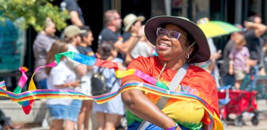 5 Best Things to Do in Colorado Springs This Weekend A woman marches in the Pikes Peak Pride Fest parade in Colorado Springs