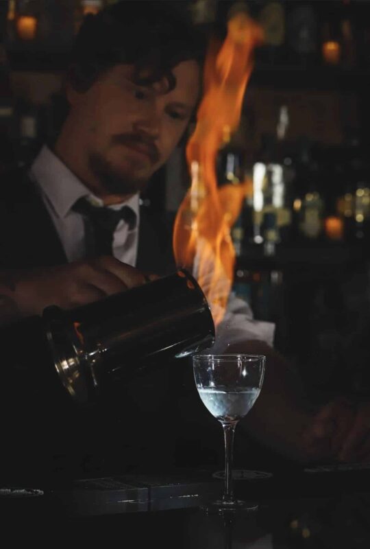 Bartender making a fiery drink at Tipperary.