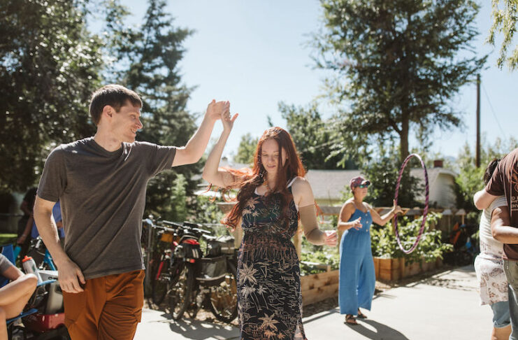 A couple dancers and a woman hula hoops at Patty Jewett Porchfest in Colorado Springs.