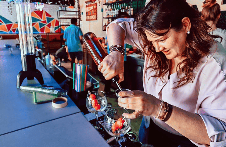 Bartender pouring drinks at Colorful Colorado at The Garden.