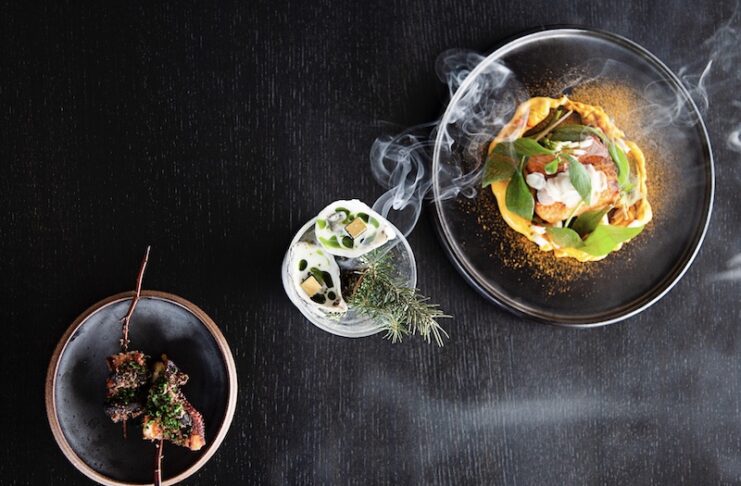 Overhead view of creative plates at Bosq in Aspen, honored with One Michelin Star