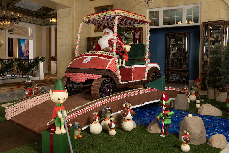 Santa Claus drives a U.S. Senior Open golf cart in the lifesize,edible gingerbread and chocolate display created by the Broadmoor pastry chefs. The gingerbread creation is one of the favorite Colorado Springs holiday traditions.