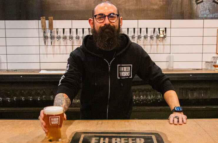 A bartender with beer at FH Beerworks, one of the People's Choice Best Breweries