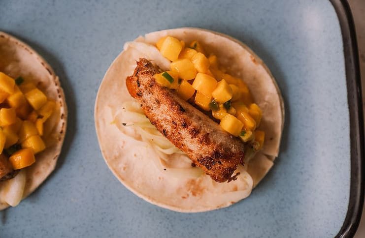 Fish taco with mango salsa at Luau's Taco Shop