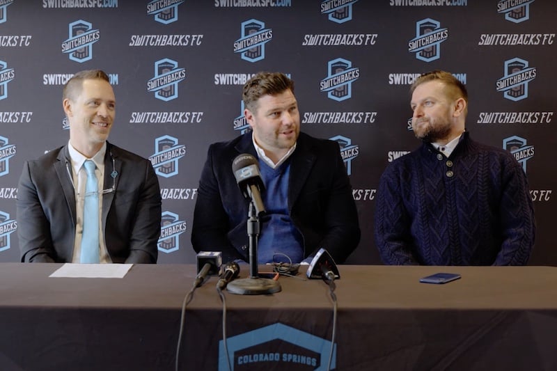 Switchbacks FC President and CEO Nick Ragain (left) announces new Head Coach James Chambers (center) and Sporting Director Stephen Hogan (right) in a press conference on Jan. 5, 2024. Photo courtesy of Switchbacks FC.