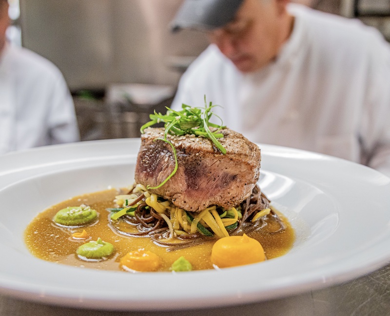 Chef James Africano prepares a beautifully presented steak at The Warehouse restaurant in Colorado Springs.