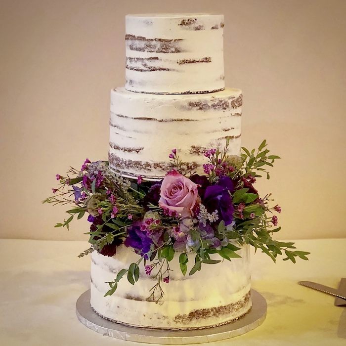 A three-tier wedding cake baked by Whitney Symington
