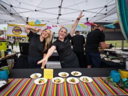 5 Best Things to Do in Colorado Springs This Weekend Servers pose for the camera at the Taste of Pikes Peak food festival in Colorado Springs.