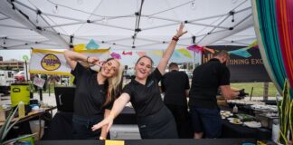 5 Best Things to Do in Colorado Springs This Weekend Servers pose for the camera at the Taste of Pikes Peak food festival in Colorado Springs.