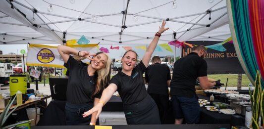 5 Best Things to Do in Colorado Springs This Weekend Servers pose for the camera at the Taste of Pikes Peak food festival in Colorado Springs.