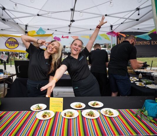 5 Best Things to Do in Colorado Springs This Weekend Servers pose for the camera at the Taste of Pikes Peak food festival in Colorado Springs.