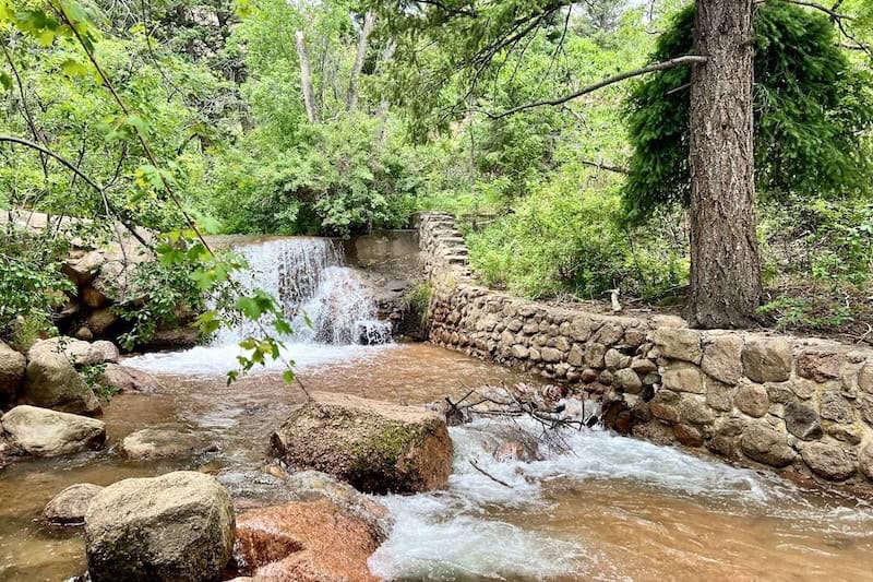 Water cascades in Cheyenne Canon, where you'll find some of the best seven waterfalls in colorado springs.