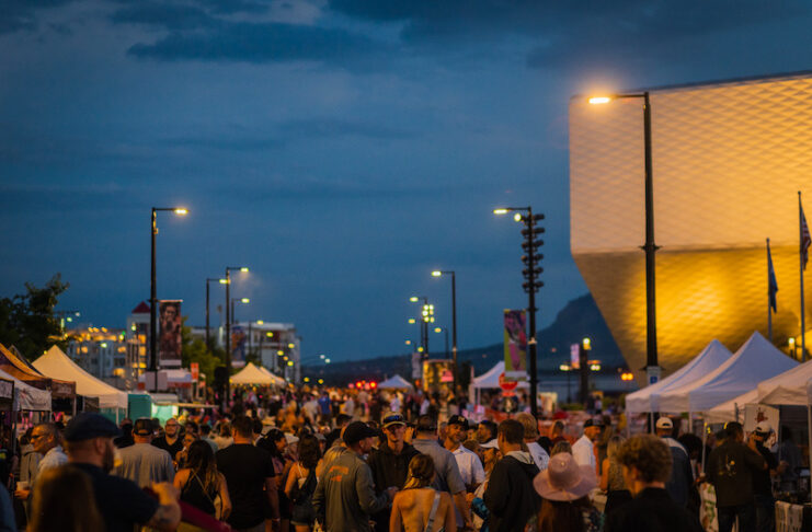 The crowd fills the street beside the U.S. Olympic and Paralympic Museum at Taste of Pikes Peak food festival in Colorado Springs.