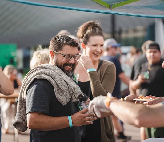 All the Best Summer Festivals in Colorado Springs A couple gets samples at Taste of Pikes Peak, Colorado Springs premier food festival