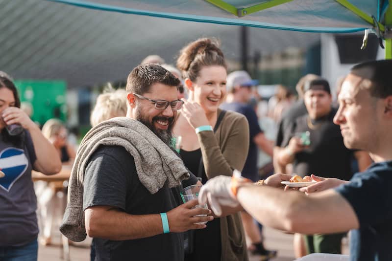 A couple gets samples at Taste of Pikes Peak, Colorado Springs premier food festival