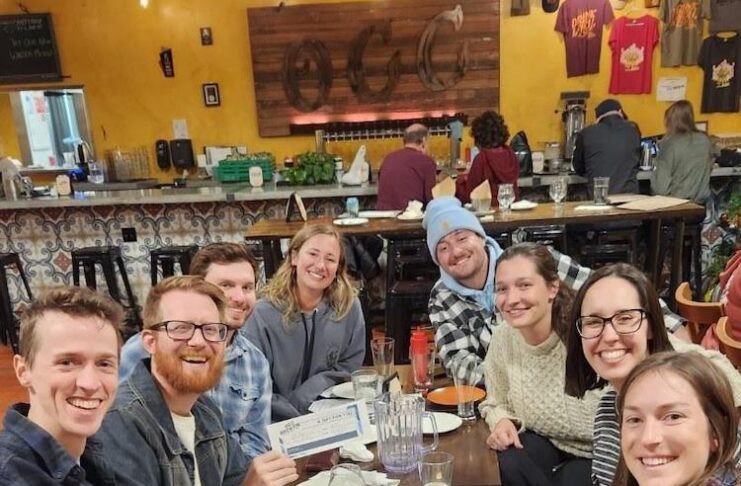 A group of friends play trivia in Colorado Springs at OCC Brewing.