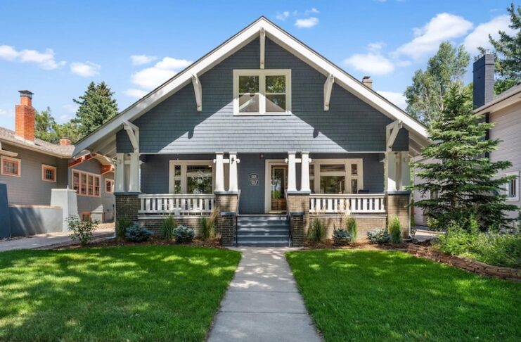 Front porch and sidewalk view of the blue Craftsman bungalow for sale at 1331 N. Wahsatch Ave.