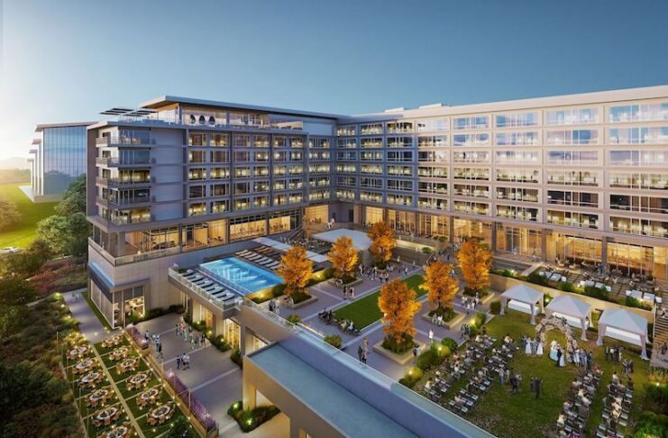 Overview of the west side of the new Hotel Polaris at the U.S. Air Force Academy, including the pool deck and outdoor event space.