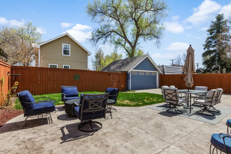 The sunny back patio and accessory dwelling unit at an Old North End home for sale in Colorado Springs