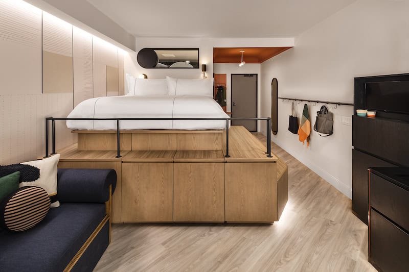 Guestroom of the Catbird Hotel with raised platform bed.