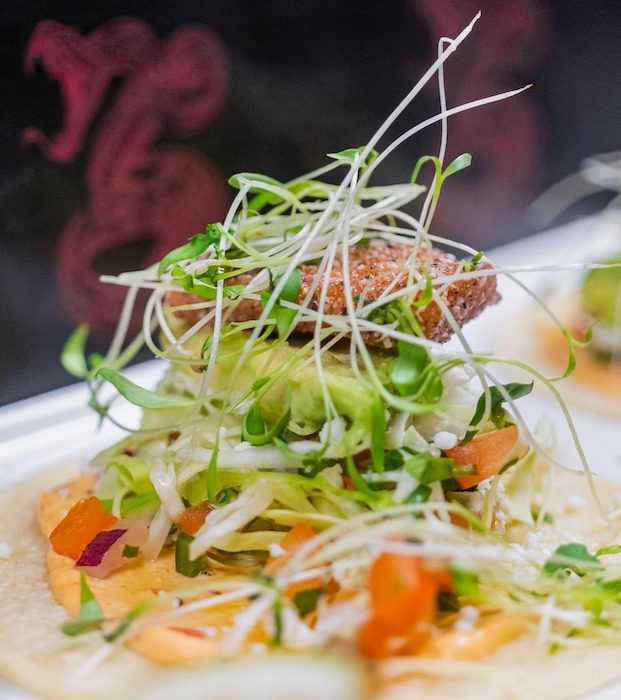 Taco topped with cilantro micro greens at The Warehouse, one of the best restaurants for happy hour in Colorado Springs