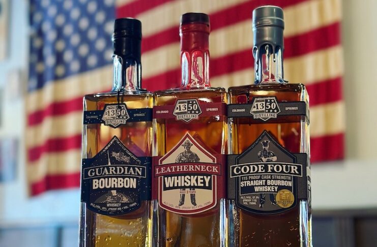 Three bottles of spirits and an American flag at 1350 Distilling in Colorado Springs.