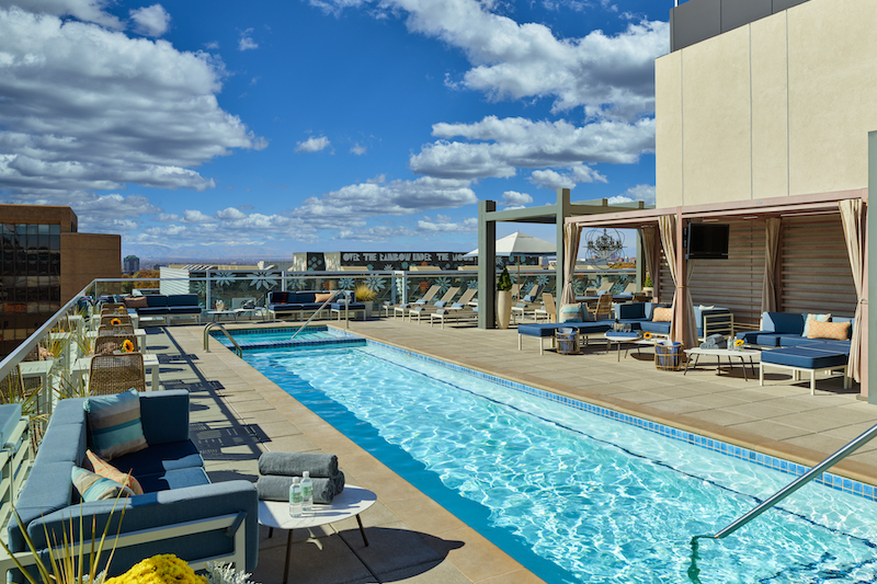 Rooftop pool and mountain view at the Halcyon Hotel, one of the best Denver hotels in Cherry Creek