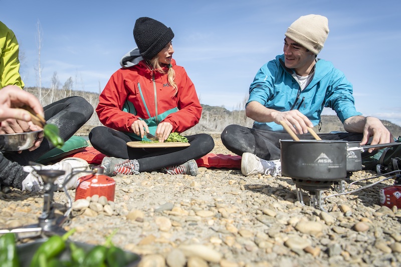 Campers cook in the mountain with an MSR WindBurner stove
