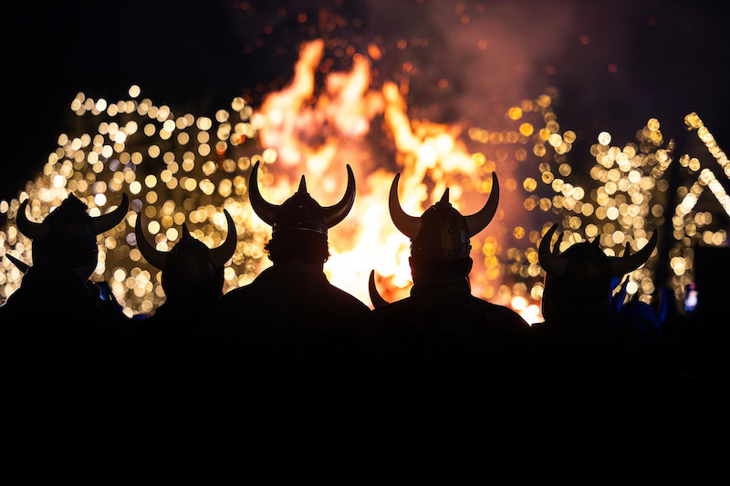 Viking helmets silhouetted against the bonfire at Ullr Fest in Breckenridge, Colorado