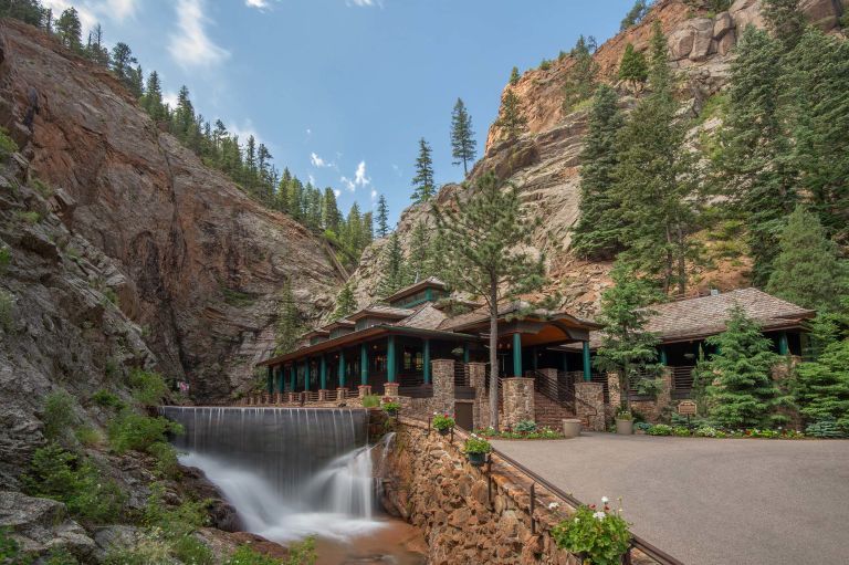 The Broadmoor's Restaurant 1858 set among the rock cliffs of Seven Falls in Cheyenne Canyon.