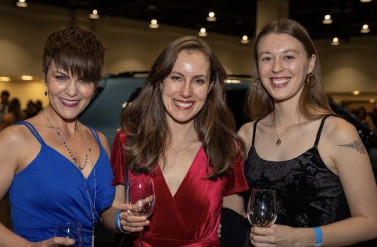 Three women at the Grand Tasting of the Wine Festival of Colorado Springs