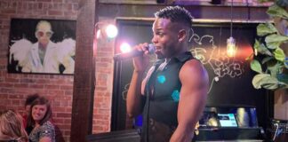 A bartender sings at Icons nightclub, the singing gay bar in Colorado Springs downtown
