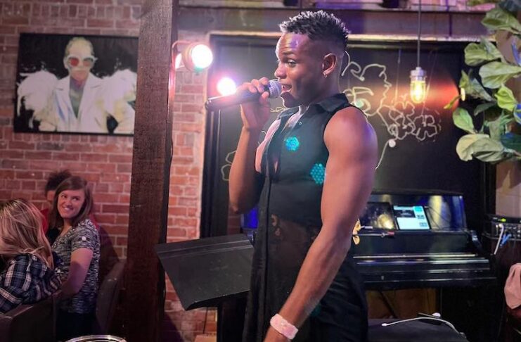 A bartender sings at Icons nightclub, the singing gay bar in Colorado Springs downtown
