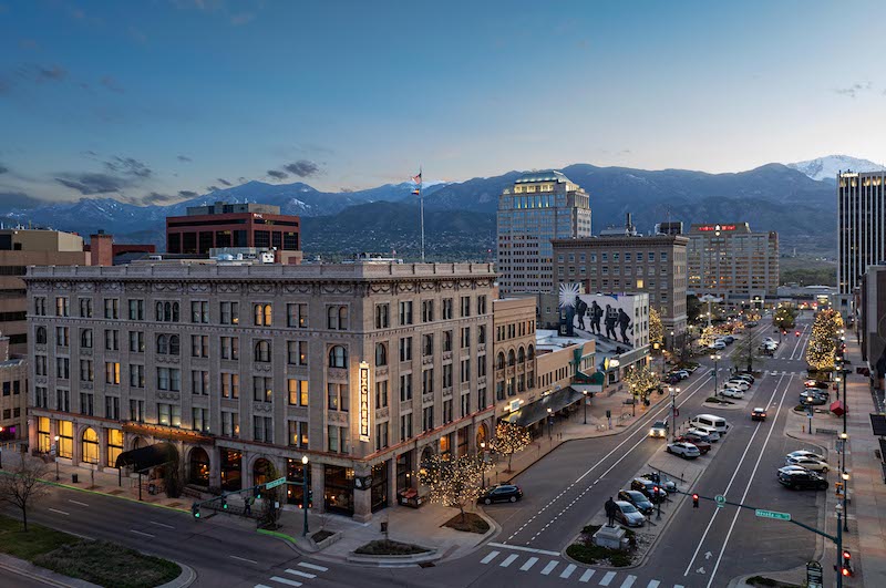 Overhead view of the Mining Exchange Hotel, Colorado Springs skyline and Pikes Peak. The hotel just announced it will open a new restaurant Oro