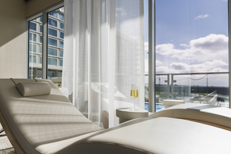 A sun-drenched chaise lounge in the Relaxation Room at Ascend Spa at Hotel Polaris, one of the best spas in Colorado Springs.