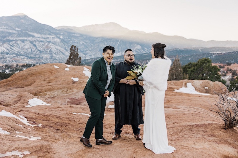LGBTQ+ wedding ceremony among the red rocks in Garden of the Gods park in Colorado Springs.