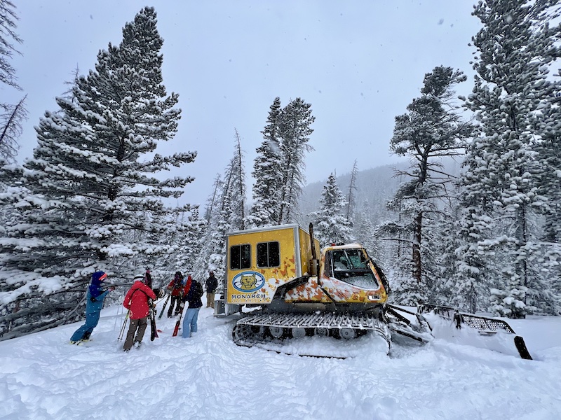 A snow cat in deep powder in the No Name Expansion at Monarch Mountain.