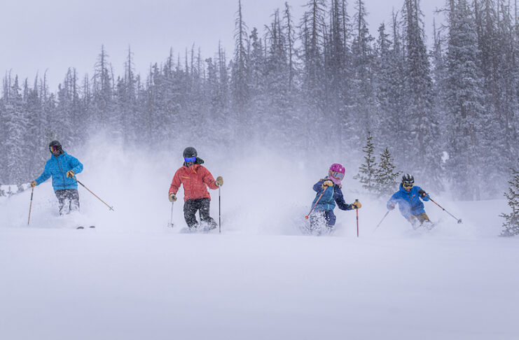 A family skis deep powder in the Monarch Mountain No Name Expansion, opening in 2025.