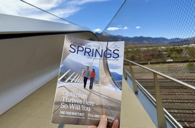 The Colorado Springs Relocation Guide 2026 on the Park Union Bridge where its cover photo was taken.