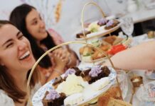 Women laughing at afternoon tea at Toodles Tea Room in Colorado Springs