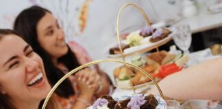 Women laughing at afternoon tea at Toodles Tea Room in Colorado Springs