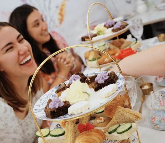 Celebrate Mom at These Delicious Mother’s Day Brunches and Teas Women laughing at afternoon tea at Toodles Tea Room in Colorado Springs