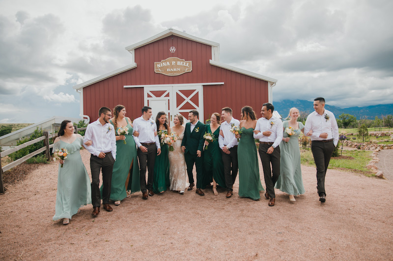A wedding party in front of the barn at Venetucci Farm.