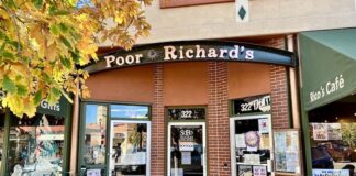 Three doorways to Poor Richard's Downtown book and gift store, Rico's Cafe and Little Richard's Toy Store in Colorado Springs.